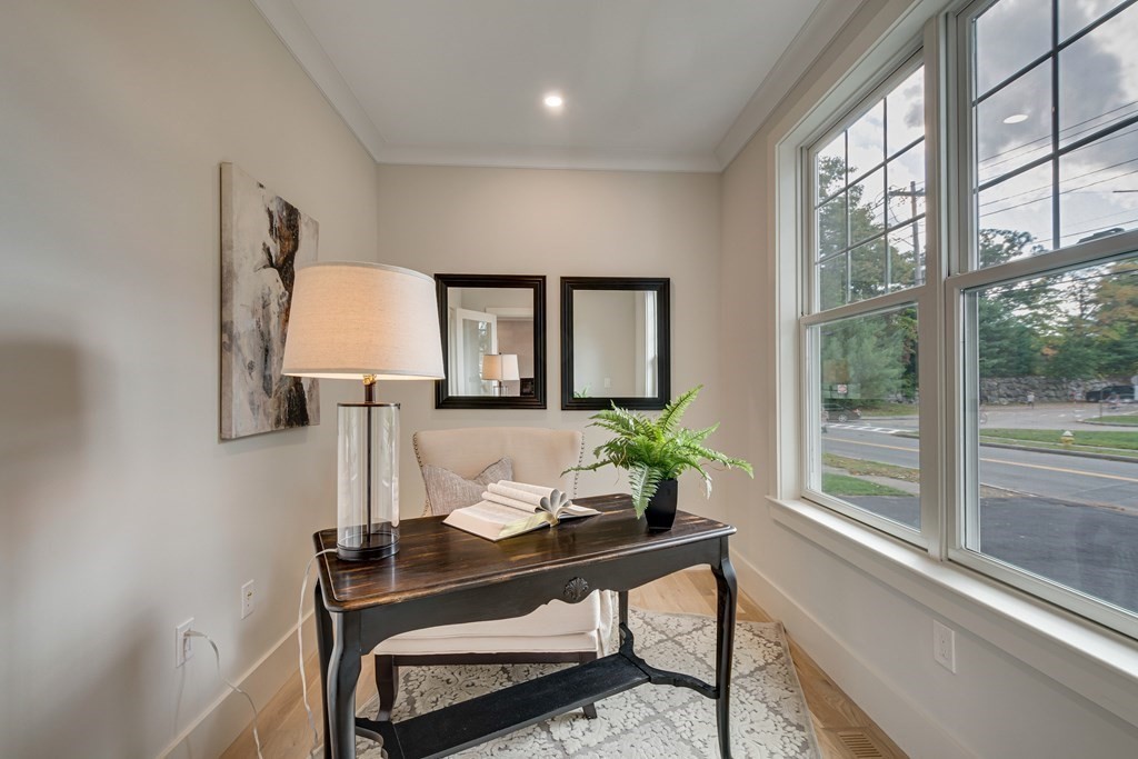638 Webster Street, Unit 638 Needham, MA 02492 - Photo 11 of 29 a living room with furniture and a potted plant on a table