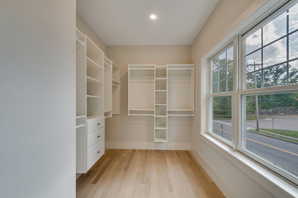 638 Webster Street, Unit 638 Needham, MA 02492 - Photo 14 of 29 wooden floor in an empty room with a window