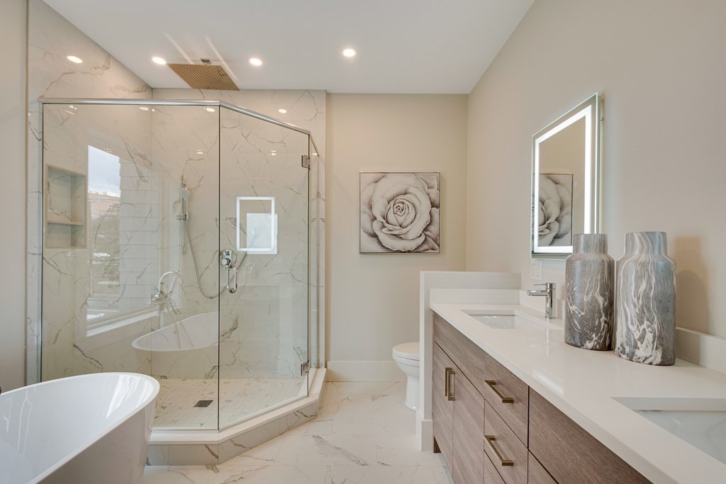 638 Webster Street, Unit 638 Needham, MA 02492 - Photo 16 of 29 a bathroom with a double vanity sink toilet and shower