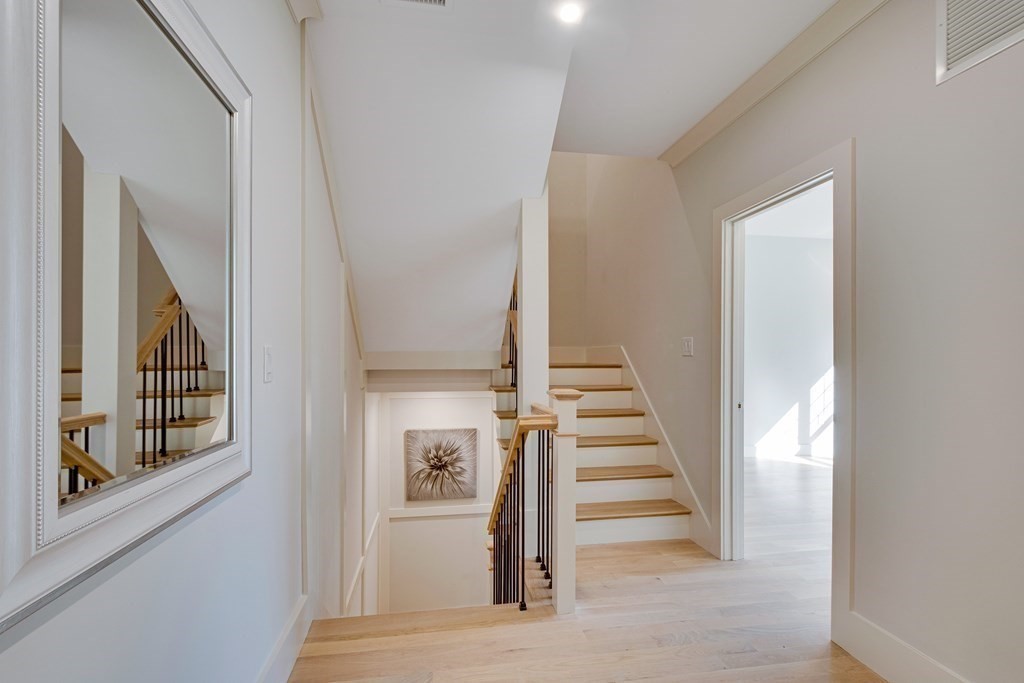 638 Webster Street, Unit 638 Needham, MA 02492 - Photo 19 of 29 a view of entryway and hall with wooden floor