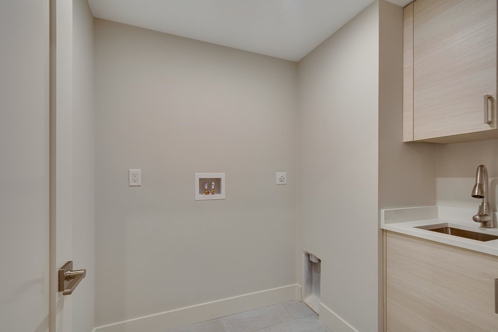 638 Webster Street, Unit 638 Needham, MA 02492 - Photo 21 of 29 a bathroom with a sink and a toilet