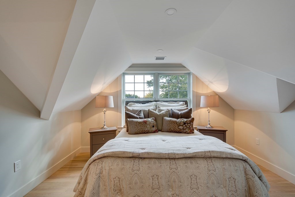 638 Webster Street, Unit 638 Needham, MA 02492 - Photo 23 of 29 a bedroom with a large bed and a large window