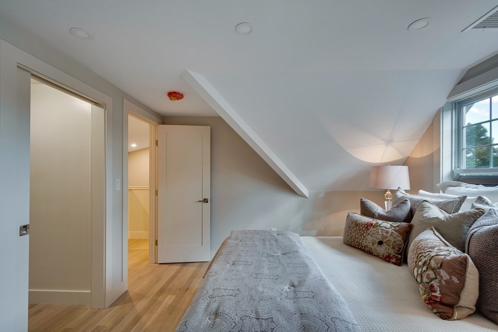 638 Webster Street, Unit 638 Needham, MA 02492 - Photo 24 of 29 a bedroom with furniture and a window