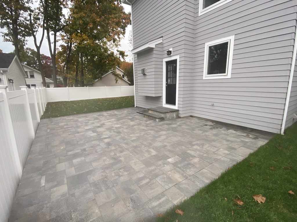 638 Webster Street, Unit 638 Needham, MA 02492 - Photo 28 of 29 a view of backyard of house with green space