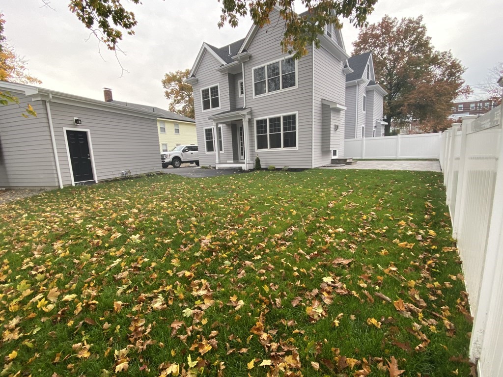 638 Webster Street, Unit 638 Needham, MA 02492 - Photo 29 of 29 a view of a house with a garden