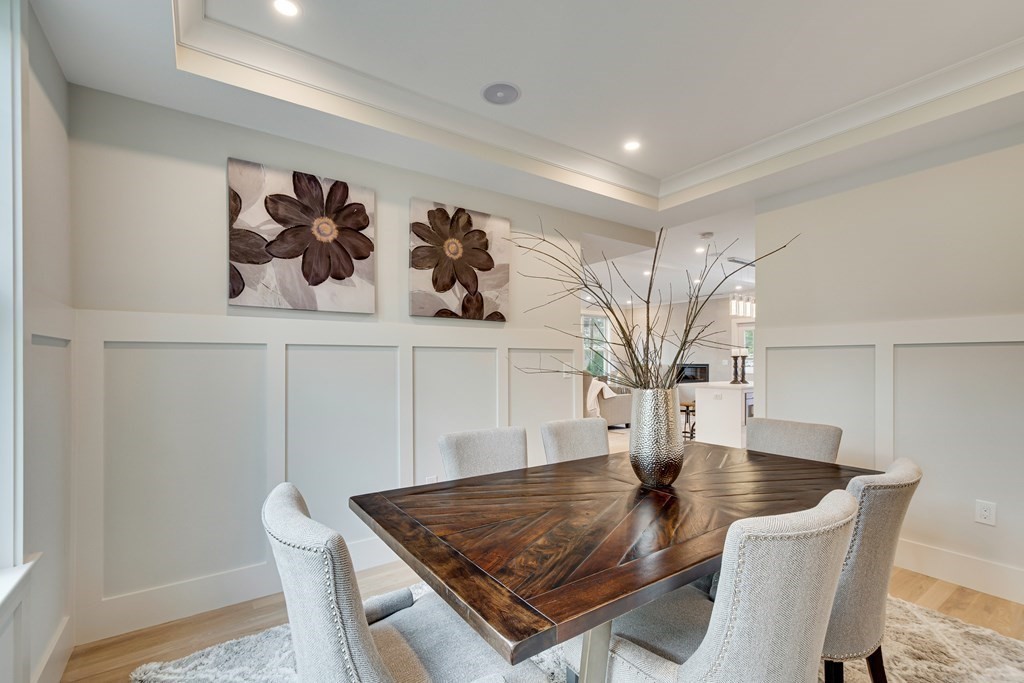 638 Webster Street, Unit 638 Needham, MA 02492 - Photo 10 of 29 a view of a dining room with a table and chairs
