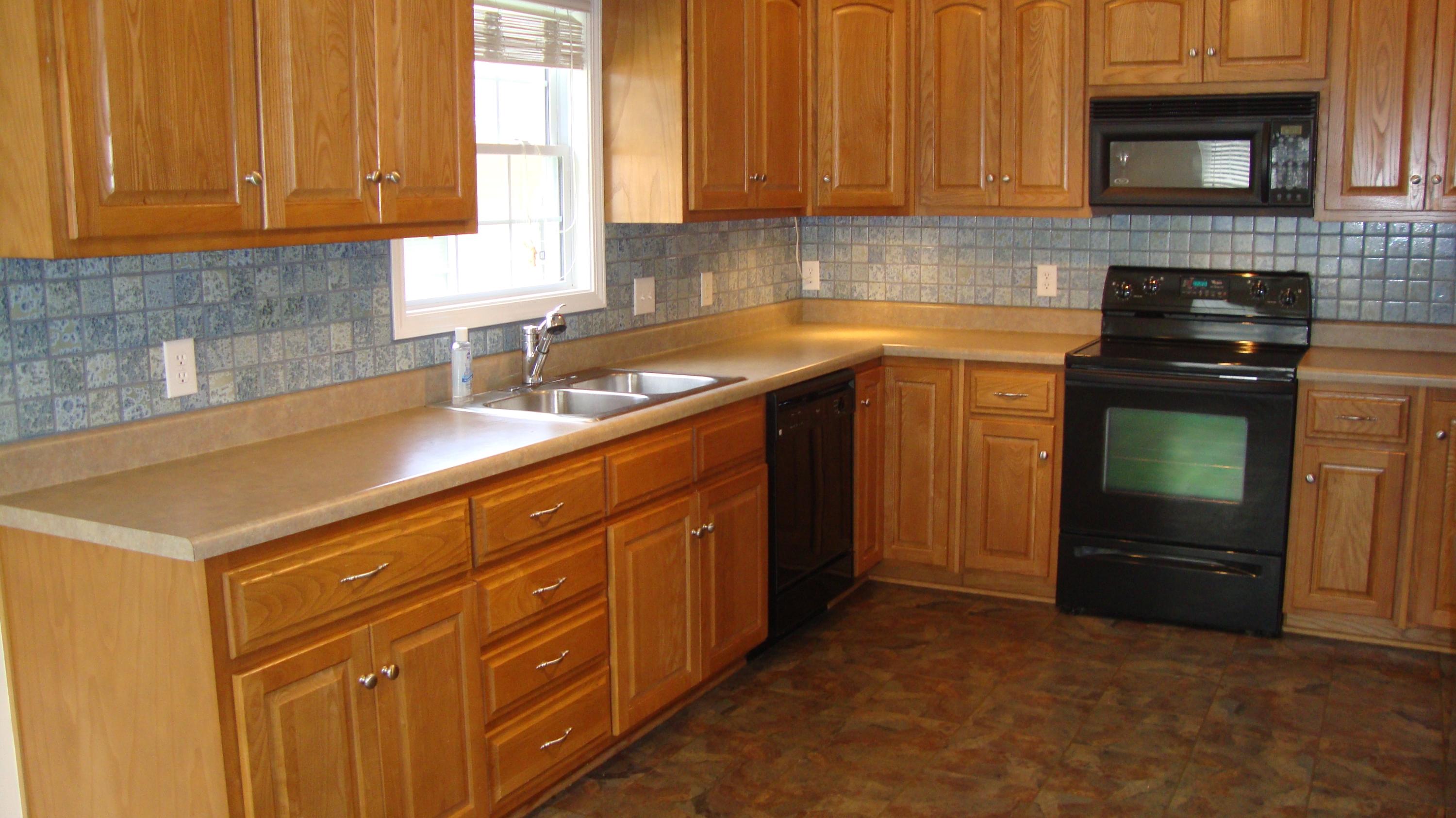 1942 Millbridge Road Salem, VA 24153 - Photo 5 of 52 Kitchen With Oak Cabinets and Cork Floor