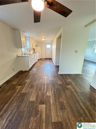 a view of a living room with wooden floor