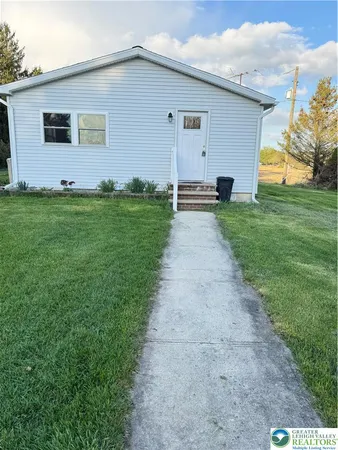 a front view of house with yard