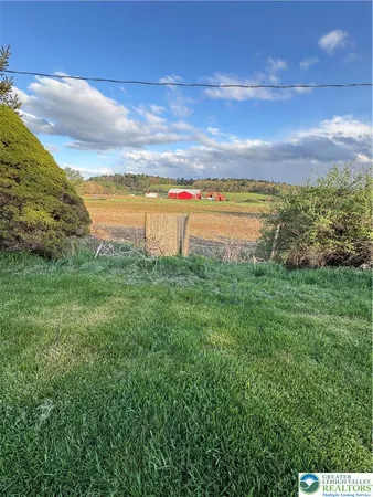 a view of a lake with a big yard