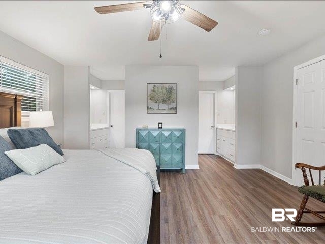 4650 Wiggins Lane Wilmer, AL 36587 - Photo 17 of 66 Bedroom featuring connected bathroom, wood finished floors, and ceiling fan