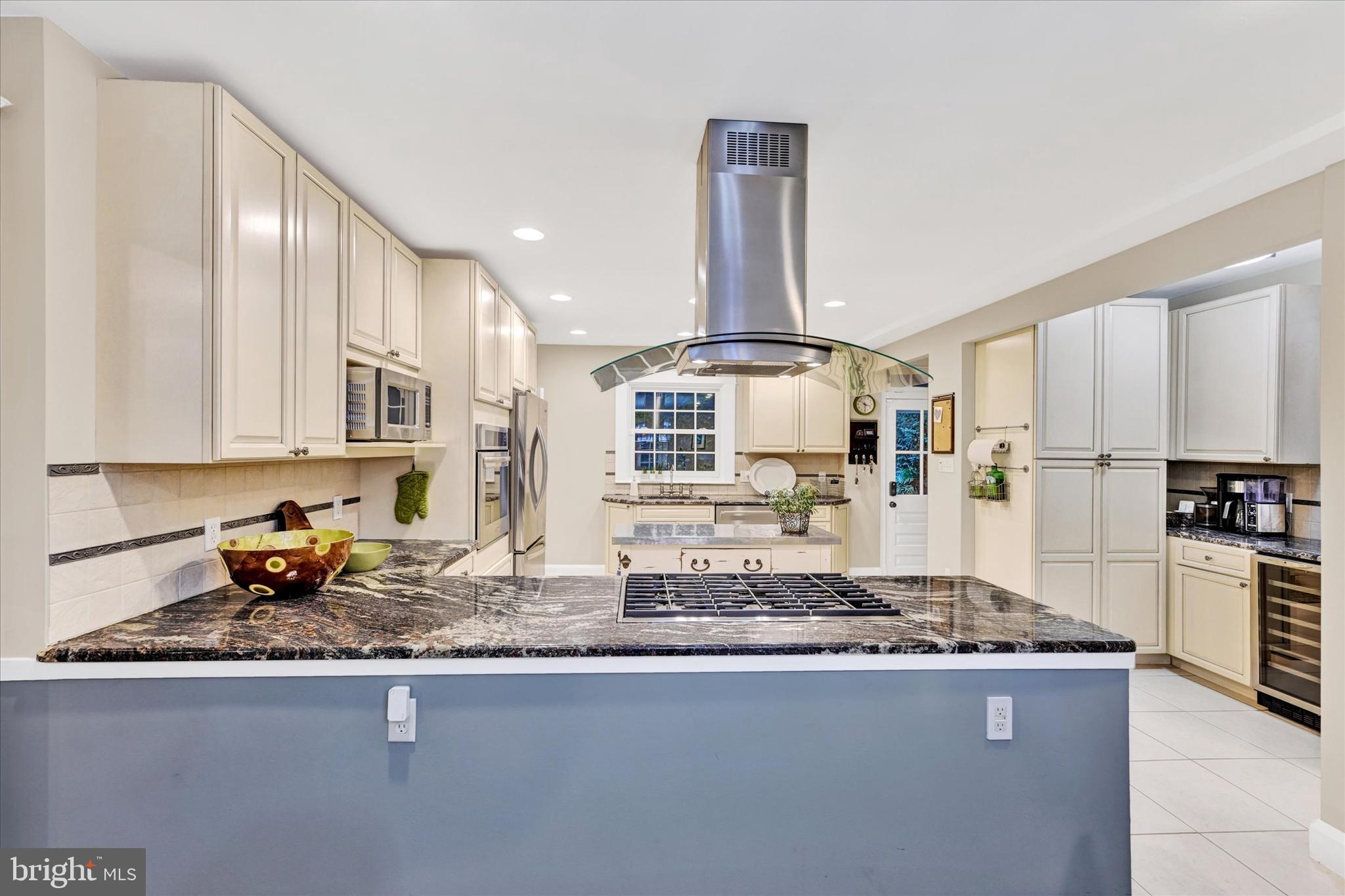 1 Merrymount Road Baltimore, MD 21210 - Photo 16 of 53 a kitchen with stainless steel appliances granite countertop a sink stove and refrigerator