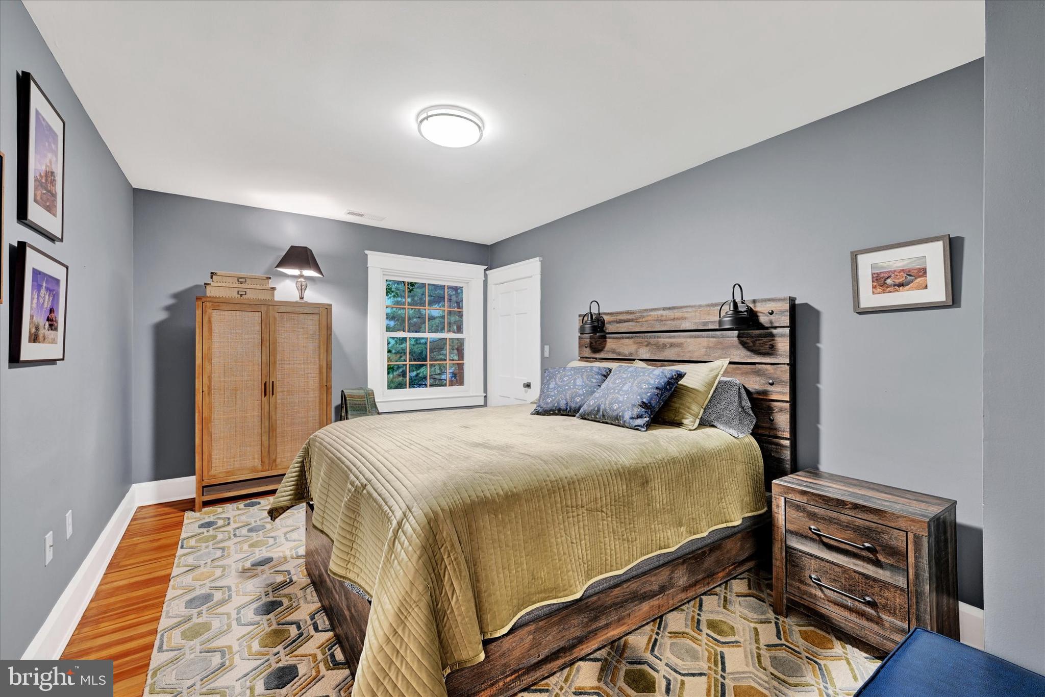 1 Merrymount Road Baltimore, MD 21210 - Photo 23 of 53 a bedroom with a bed and wooden floor