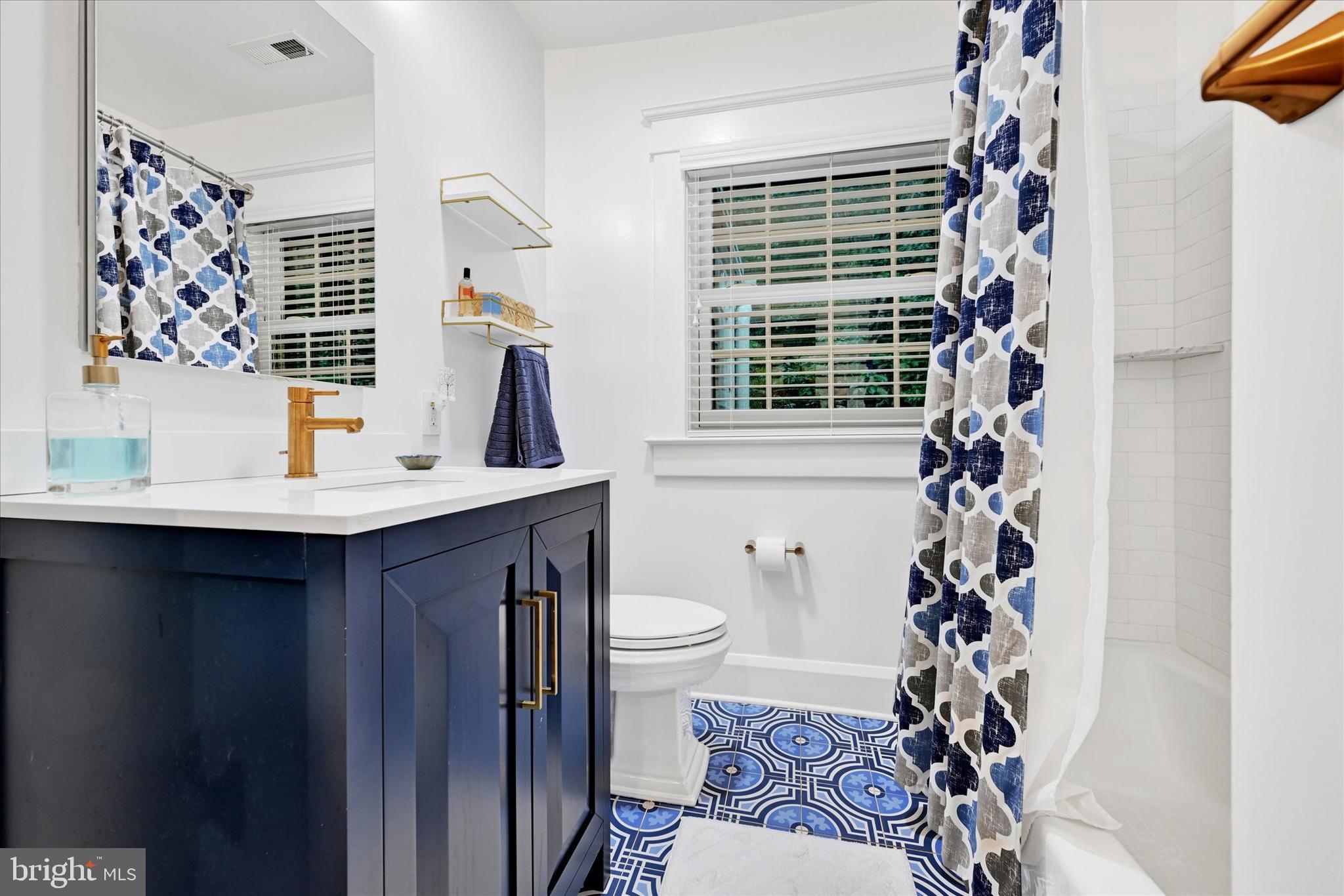 1 Merrymount Road Baltimore, MD 21210 - Photo 29 of 53 a bathroom with a sink toilet and shower