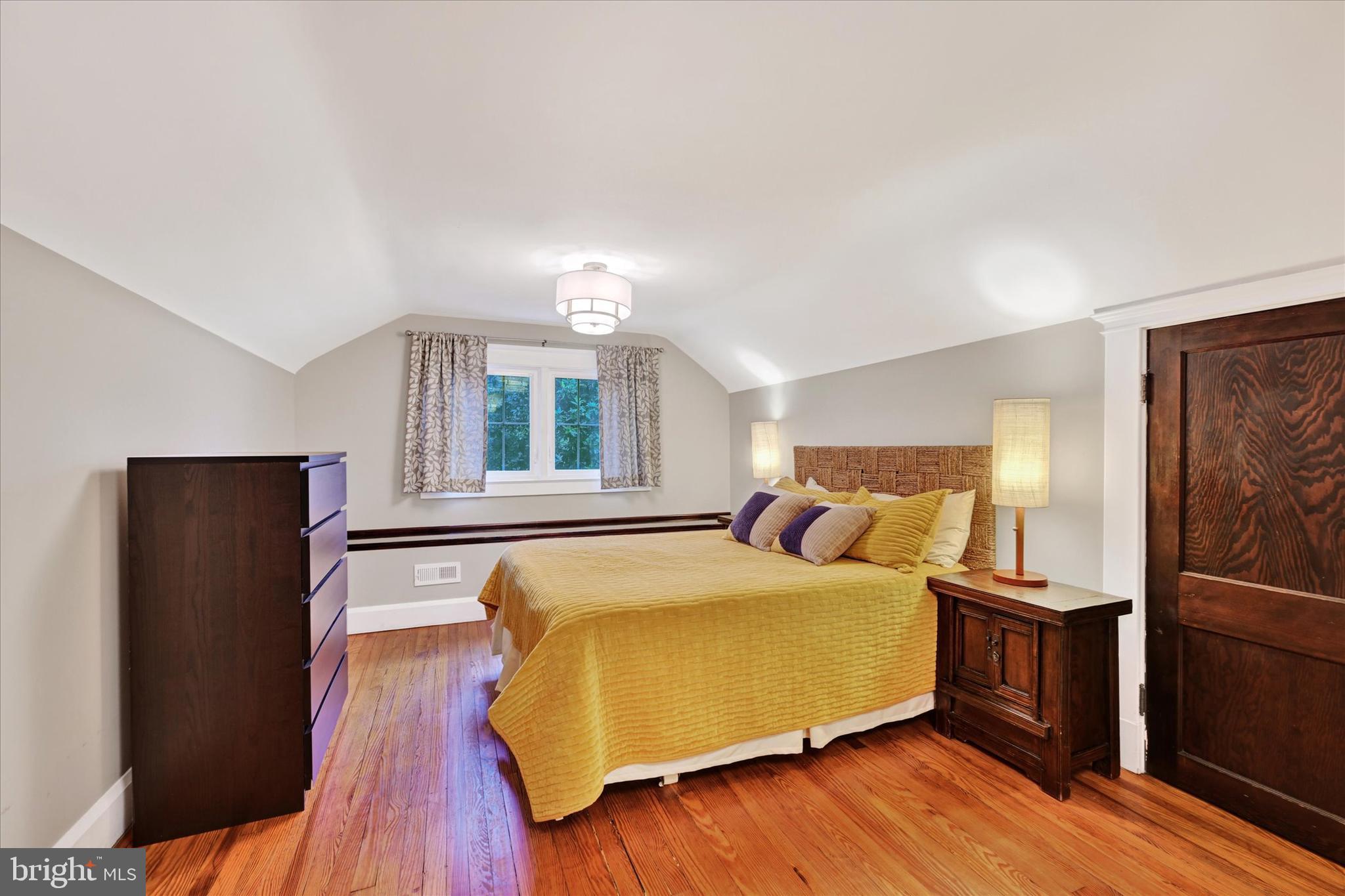 1 Merrymount Road Baltimore, MD 21210 - Photo 33 of 53 a bedroom with a bed and wooden floor