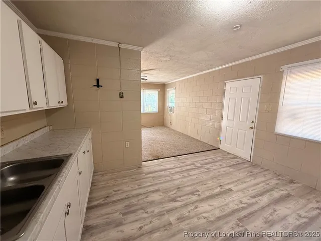 a view of a kitchen cabinets and wooden floor