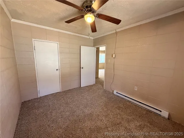 a view of room with a ceiling fan