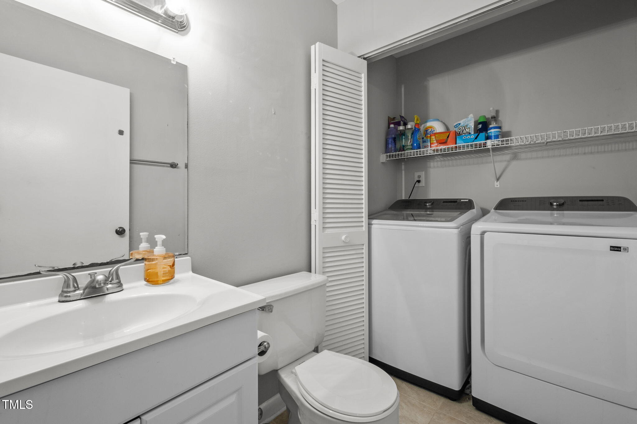 167 Springberry Lane Chapel Hill, NC 27517 - Photo 14 of 37 a bathroom with a sink a toilet and a mirror