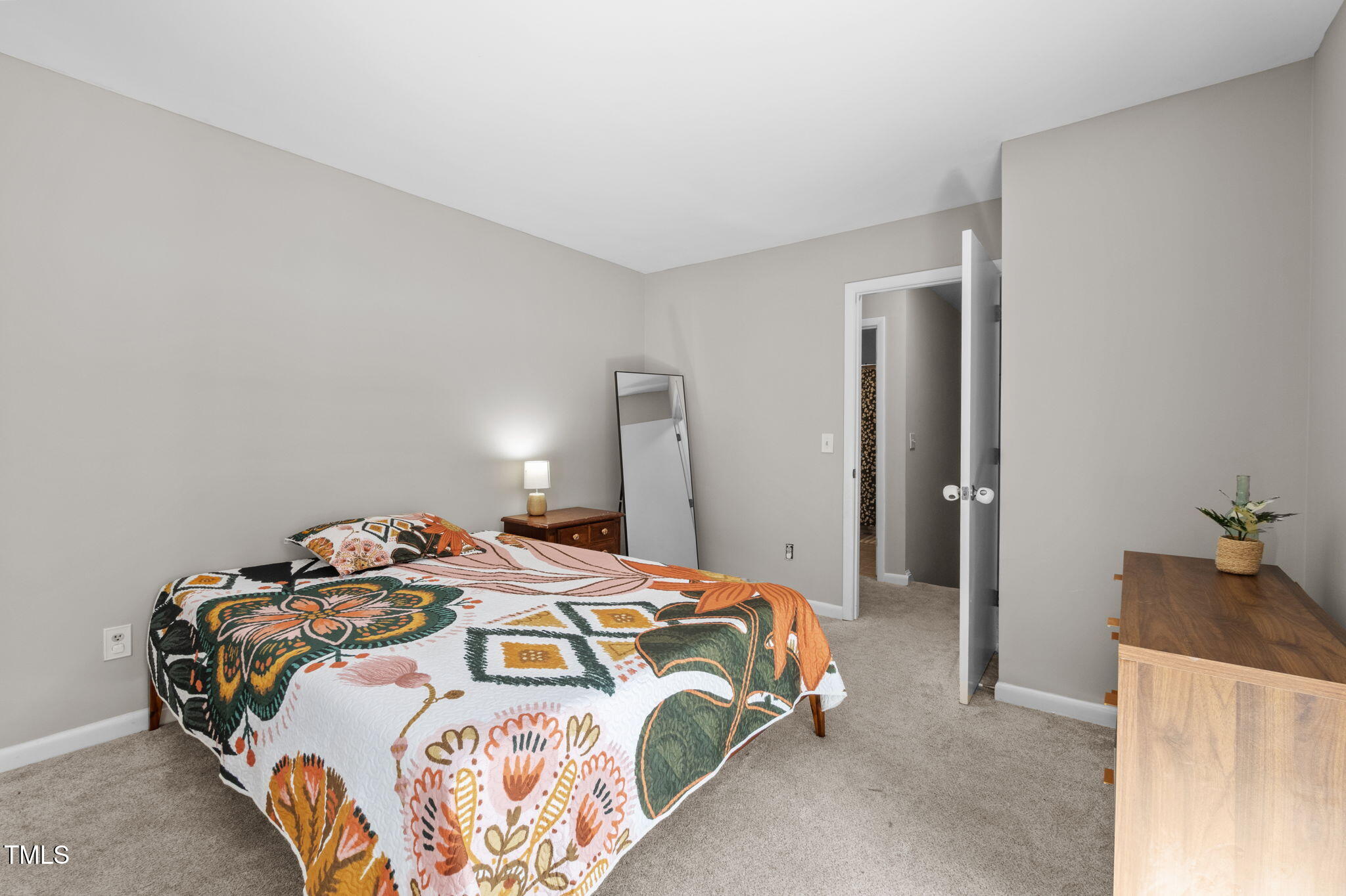 167 Springberry Lane Chapel Hill, NC 27517 - Photo 23 of 37 a bedroom with a bed and wooden floor