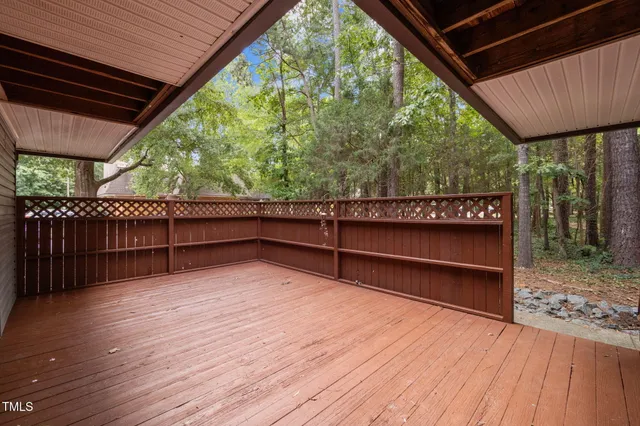a view of backyard with wooden floor and outdoor seating