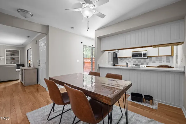 a view of a dining room with furniture and wooden floor