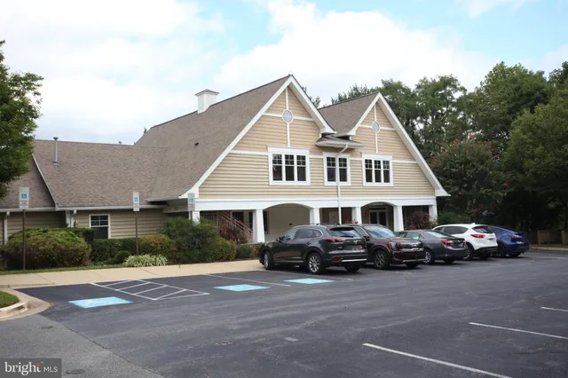 a view of a house with patio and a garden