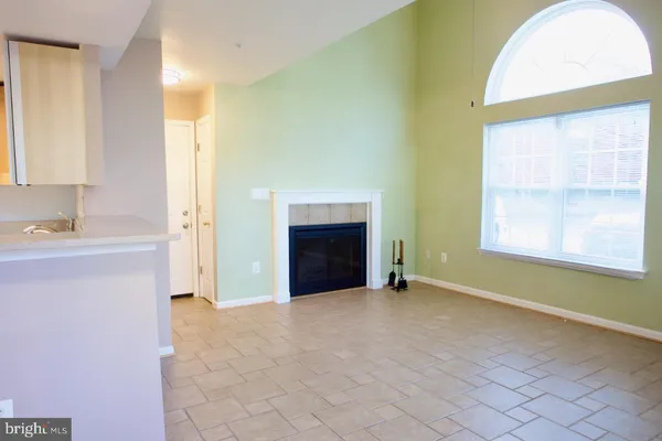 a view of a livingroom and a fireplace