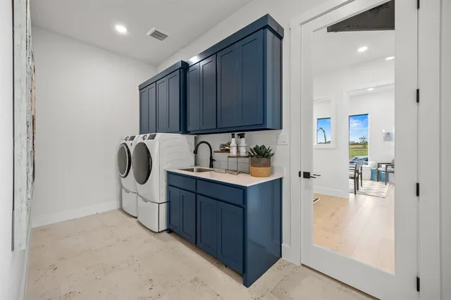a living room with furniture a ceiling fan and a flat screen tv