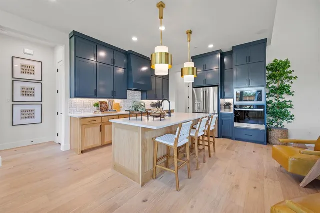 a kitchen with a sink cabinets and window