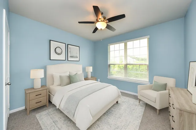 a bedroom with a bed and window