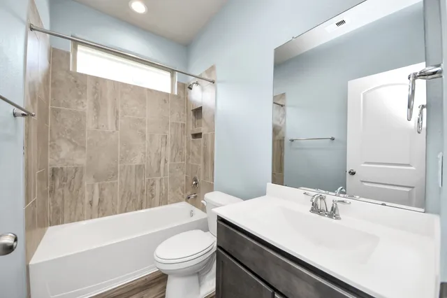 a bathroom with a sink a toilet and a bathtub