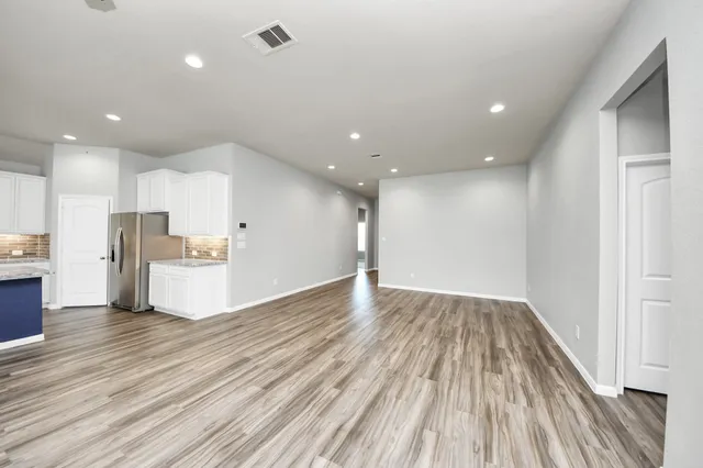 a view of kitchen with wooden floor