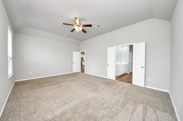 a view of a big room with carpet
