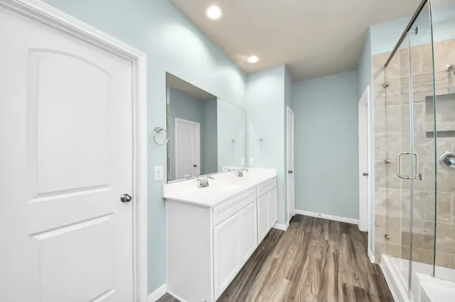 a bathroom with a sink and mirror