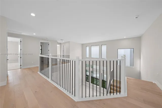 a view of a hallway with windows