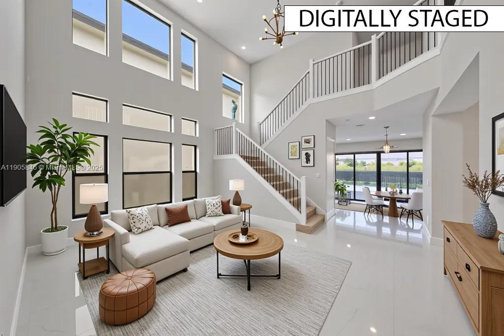 20422 Southernwood Avenue Boca Raton, FL 33434 - Photo 3 of 23 a living room with furniture potted plant and a large window