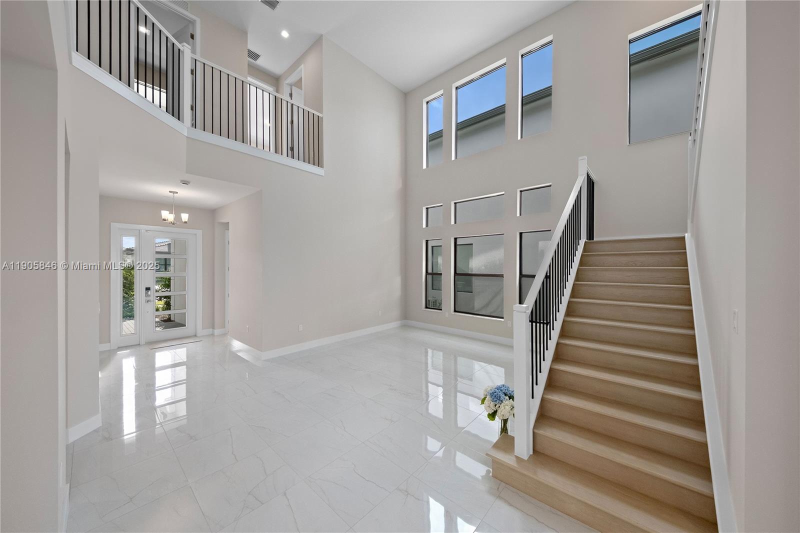 20422 Southernwood Avenue Boca Raton, FL 33434 - Photo 6 of 23 a view of staircase with white walls and windows
