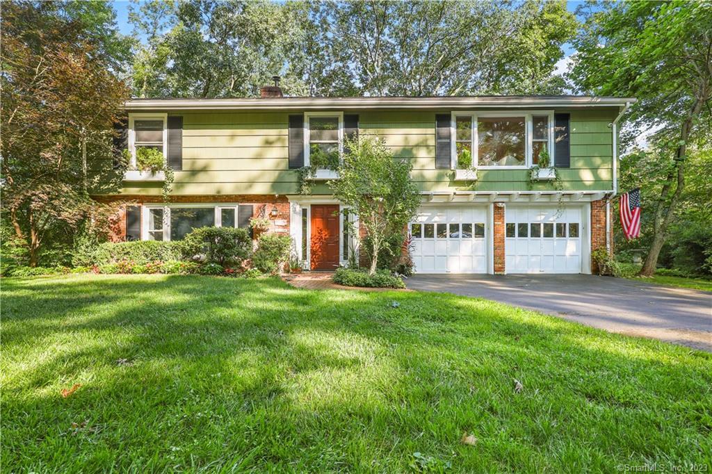 59 Range Road Wilton, CT 06897 - Photo 1 of 1 front view of a house with a yard