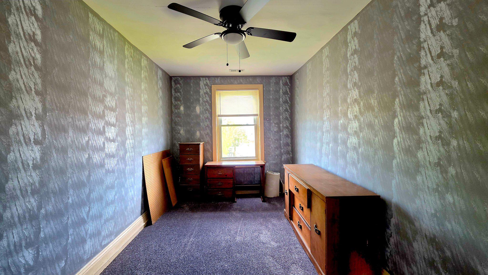 136 4th Avenue Roebling, NJ 08554 - Photo 13 of 18 a bedroom with a bed and a chandelier