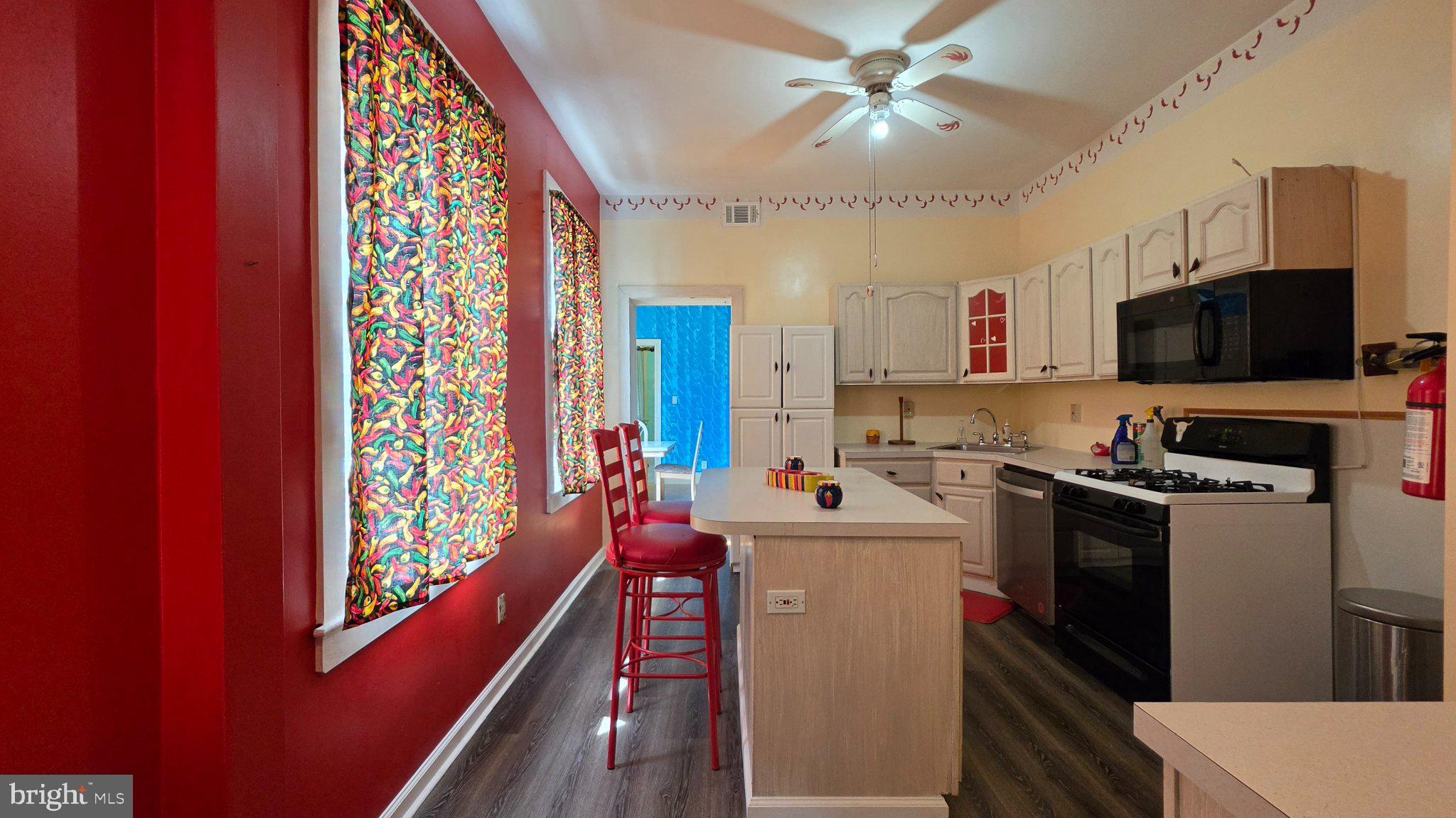 136 4th Avenue Roebling, NJ 08554 - Photo 6 of 18 a kitchen that has a lot of cabinets a sink and a stove