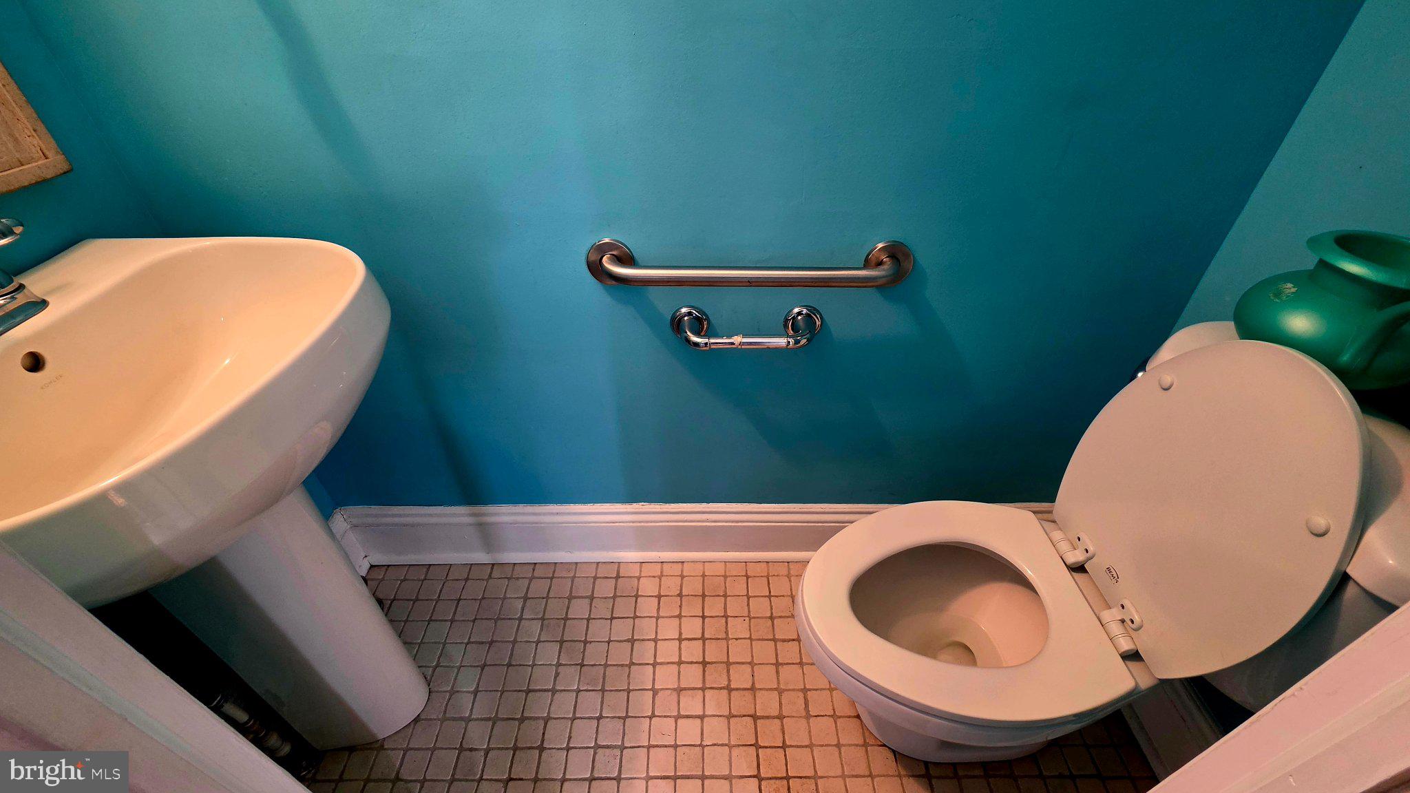 136 4th Avenue Roebling, NJ 08554 - Photo 7 of 18 a bathroom with a toilet and a sink