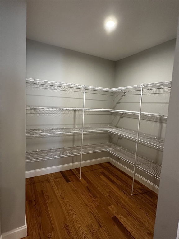 56 Dudley Road Billerica, MA 01821 - Photo 8 of 29 a room with walk in closet and empty racks