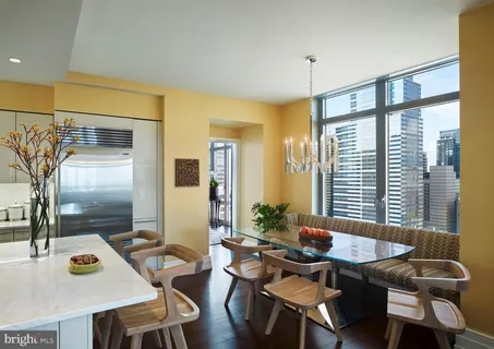 a view of a dining room with furniture and window