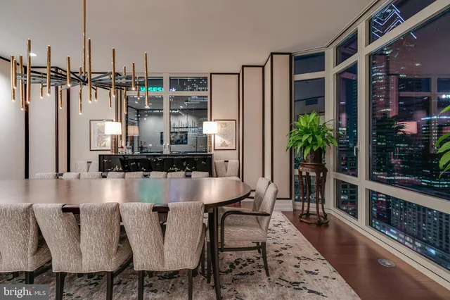 a dining room with furniture and wooden floor