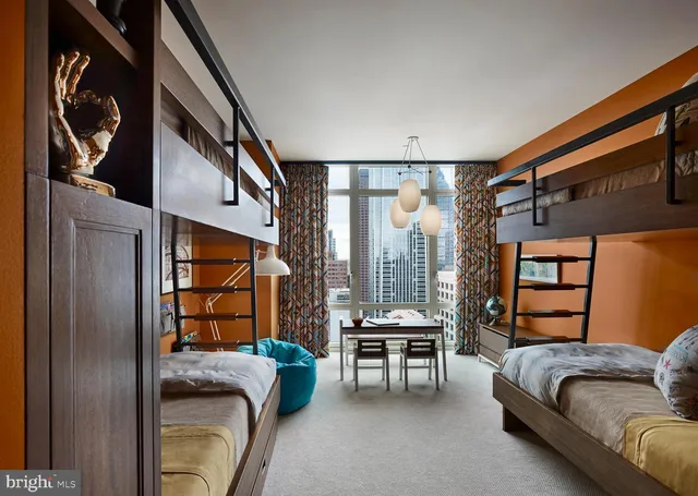 a bedroom with furniture and a window