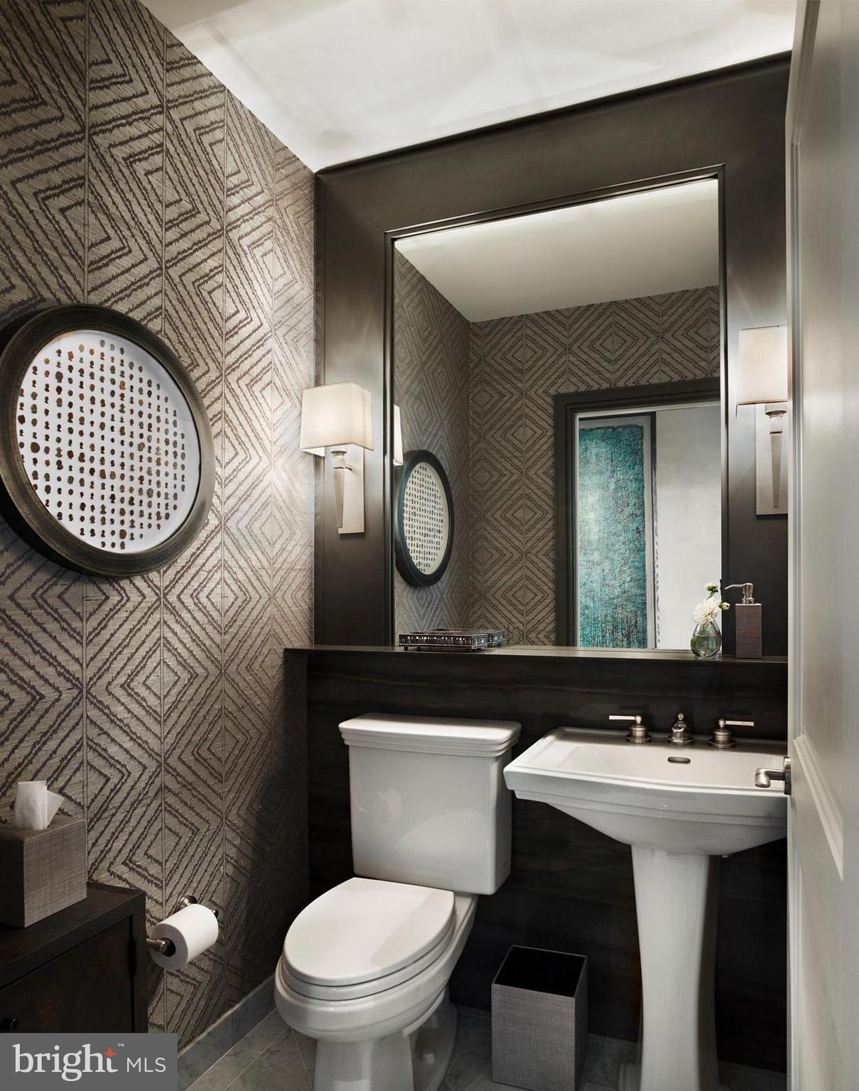 130 South 18th Street, Unit 2803 Philadelphia, PA 19103 - Photo 8 of 32 a bathroom with a toilet a sink and mirror