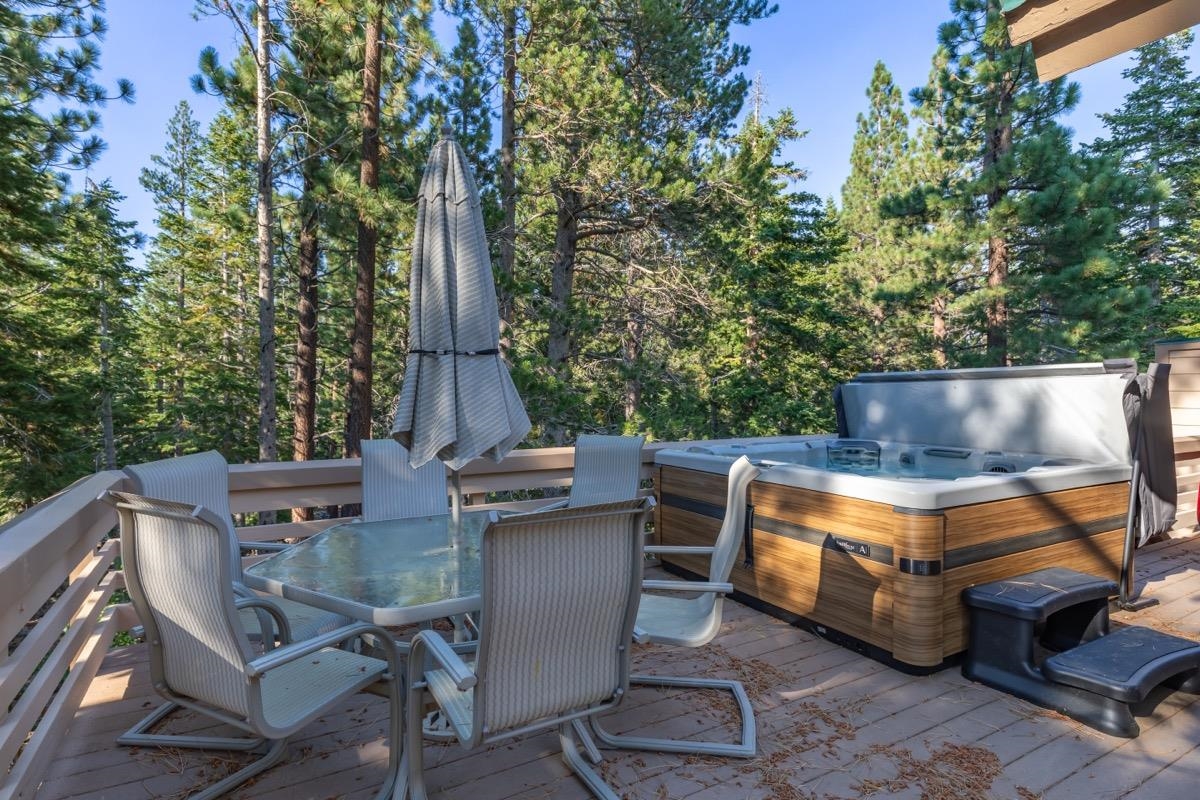 2500 Old Mammoth Road Mammoth Lakes, CA 93546 - Photo 47 of 48 a view of a patio with table and chairs with wooden fence and plants