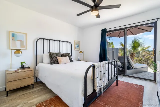 a view of a house with backyard porch and sitting area