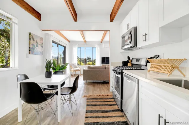 a kitchen with stainless steel appliances kitchen island granite countertop a sink and cabinets