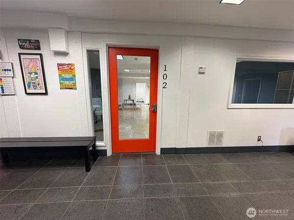 a bathroom with a shower and a sink